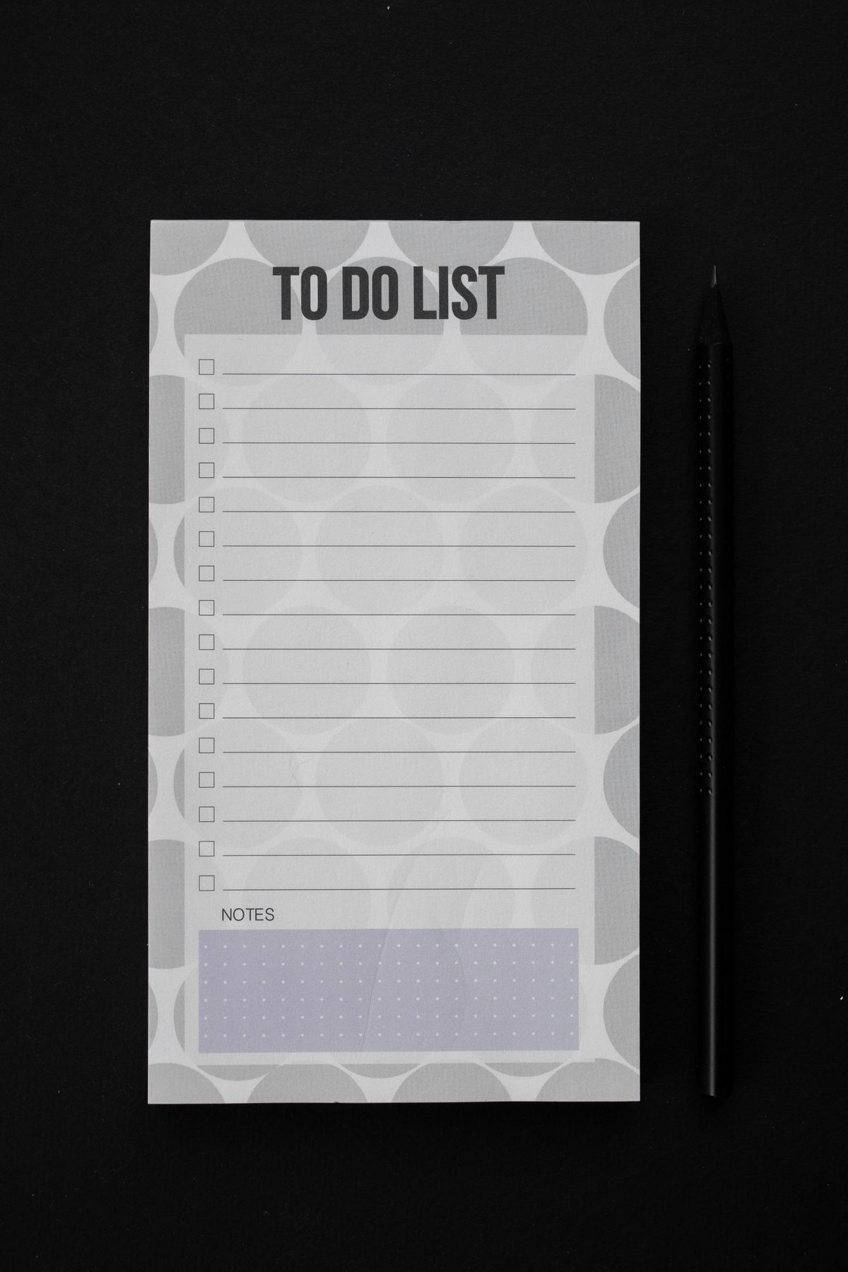 A checklist and pen laid out on a planning desk
